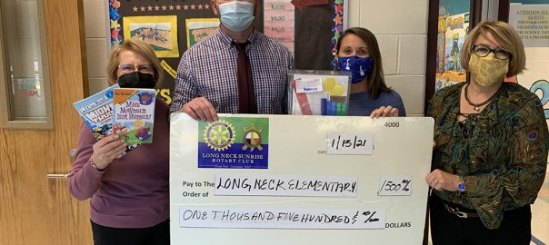 Photo of presentation of check to Long Neck Elementary for Activity Bags