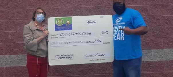 Photo of check donation to boys and girls club